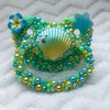 Green and Blue Seashell Seconds BP Paci